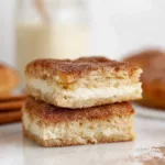 Churro Cheesecake Bars plated on white ceramic plate in modern kitchen